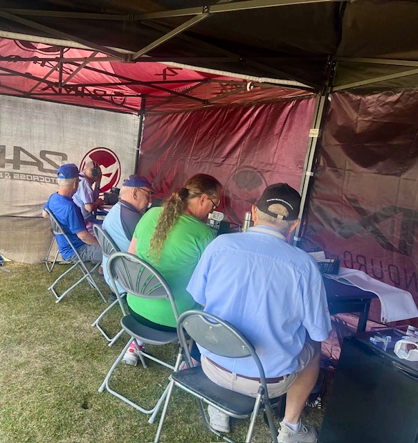 Club members operating the radios and talking to local stations
